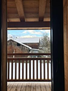 a view from a window of a barn at Appt 4 pers, 2 min Ski et Commerce in Morillon +1 photo