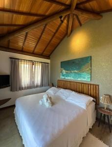 Ένα ή περισσότερα κρεβάτια σε δωμάτιο στο Joju Bangalôs & Bistrô