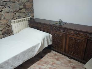 Ένα ή περισσότερα κρεβάτια σε δωμάτιο στο Habitaciones Rurales Los Semellones