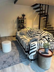 Ένα ή περισσότερα κρεβάτια σε δωμάτιο στο Cozy Guesthouse with Bathtub in Alto Boquete