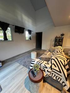 Ένα ή περισσότερα κρεβάτια σε δωμάτιο στο Cozy Guesthouse with Bathtub in Alto Boquete