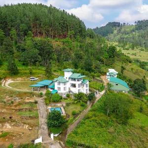 an aerial view of a house on a hill at The Colonial Crest in Nillambe