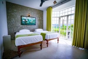 Ένα ή περισσότερα κρεβάτια σε δωμάτιο στο The Colonial Crest