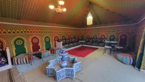 an overhead view of a living room with a table and chairs at Ez-zine Glam in El Aadamna +30 photos