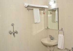 a bathroom with a sink and a mirror at Amer Classic - A Heritage Stay Near Amer Fort in Jaipur +70 photos