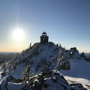 a lighthouse on top of a mountain in the snow at Bed and Breakfast Du Repos in Saint Quentin