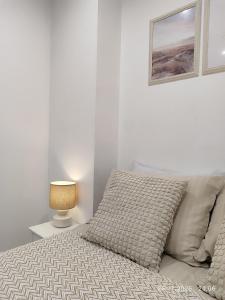 Ένα ή περισσότερα κρεβάτια σε δωμάτιο στο PortStreet apartamenti