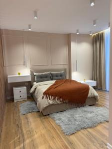 Ένα ή περισσότερα κρεβάτια σε δωμάτιο στο Sapphire Residency