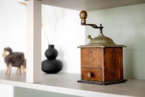 a wooden lantern sitting on a shelf in a room at ReiWaSchHOF in Dobersberg