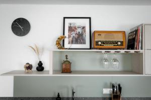 a shelf with a radio and a clock on it at ReiWaSchHOF in Dobersberg