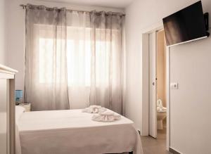 En eller flere senge i et værelse på Estudio cerca de la playa y del centro + 2 billeder