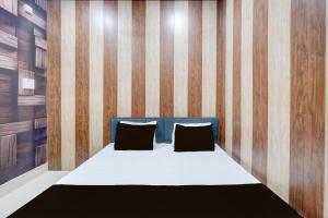 Ένα ή περισσότερα κρεβάτια σε δωμάτιο στο SPOT ON The Yeble Hotel And Restaurant