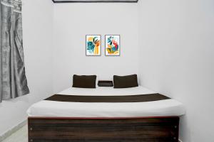 Ένα ή περισσότερα κρεβάτια σε δωμάτιο στο Hotel O Shubh Residency