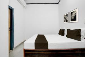 Ένα ή περισσότερα κρεβάτια σε δωμάτιο στο Hotel O Shubh Residency +21 φωτογραφίες