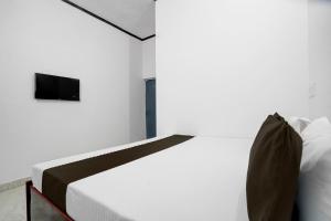 Ένα ή περισσότερα κρεβάτια σε δωμάτιο στο Hotel O Shubh Residency