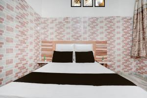 Ένα ή περισσότερα κρεβάτια σε δωμάτιο στο Hotel O prream view