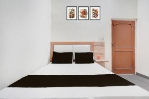 Ένα ή περισσότερα κρεβάτια σε δωμάτιο στο Hotel O prream view