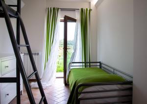 Postel nebo postele na pokoji v ubytování Agriturismo Sensi