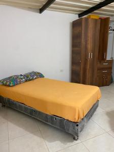 Ένα ή περισσότερα κρεβάτια σε δωμάτιο στο El Guadualito
