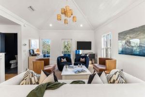 a living room with a couch and chairs at The Last Waltz in Seacrest