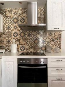 Η κουζίνα ή μικρή κουζίνα στο Stymfalia Cozy Village Guesthouse