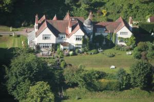 an aerial view of a large house on a hill at Fauhope Country House in Melrose
