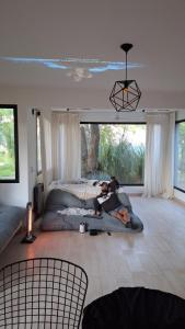 a man and a woman laying on a bed in a bedroom at Casa XIII in Costa del Este +42 photos