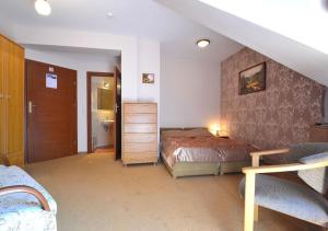 Postel nebo postele na pokoji v ubytování Willa Zarębek