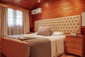 Postel nebo postele na pokoji v ubytování Hotel Bertoluci