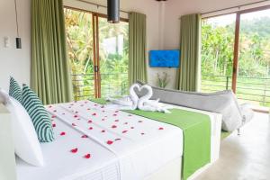 En eller flere senge i et værelse på Villa Paddy Breeze