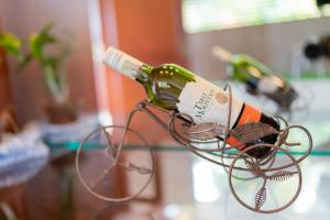 a bottle of wine in a wine rack on a table at Villa Paddy Breeze in Galle