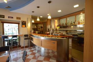 a bar in a restaurant with a counter at Hotel Residence Sant'Anna in Bedonia