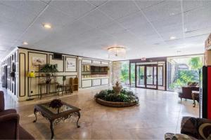 a living room with a couch and a table at Eco Inn Suites by Hotel O Baytown in Baytown