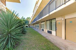 an empty walkway next to a building at Eco Inn Suites by Hotel O Baytown in Baytown