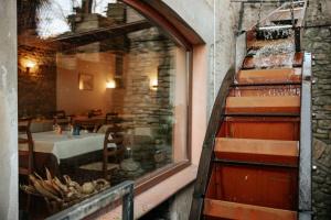a window of a restaurant with a table in a room at Locanda Del Mulino in Maranello