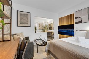 a hotel room with a bed and a desk at The Sherbrooke Suite 101 in Montreal