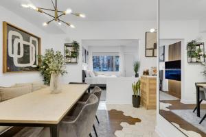a dining room and living room with a table and chairs at The Sherbrooke Suite 101 in Montreal +22 photos