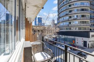 a balcony with a bench and a building at The Sherbrooke Suite 99 in Montreal