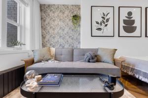 a living room with a couch and a coffee table at The Speakeasy Suite 502 With Parking in Montreal