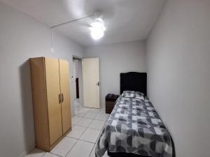 Ένα ή περισσότερα κρεβάτια σε δωμάτιο στο Sossego 2