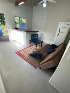 Televiisor ja/või meelelahutuskeskus majutusasutuses casa de temporada litoral Boraceia Beach