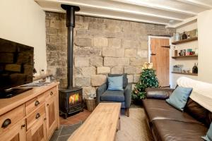 Posezení v ubytování Wash House Cottage