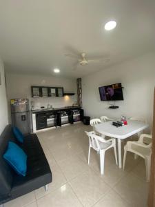a living room with a couch and a table at Apartamentos LUISA in Coveñas