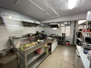 a large kitchen with a lot of equipment in it at The Rivanta Hotel Near Airport Road Mohali Zirakpur Chandigarh in Zirakpur
