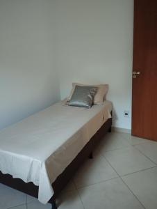 Ένα ή περισσότερα κρεβάτια σε δωμάτιο στο Sobrado Harmonia