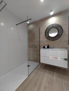 a bathroom with a shower and a sink and a mirror at Casa Fuerte y Levamt in Villaverde +49 photos