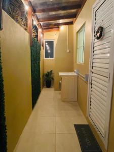 a hallway of a room with yellow walls at Casa das Oliveiras in Torres +32 photos