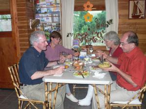 a group of people sitting at a table eating food at Adela y Helmut in Cunco
