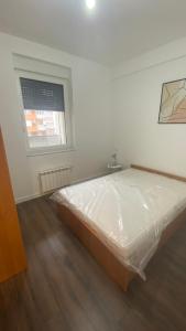 Giường trong phòng chung tại Apartman Ideal