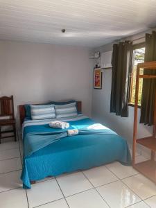 Ένα ή περισσότερα κρεβάτια σε δωμάτιο στο Buena Onda Suites